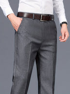 Men's grey tailored trousers for layering through autumn and winter