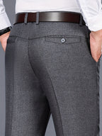 Men's grey tailored trousers for layering through autumn and winter