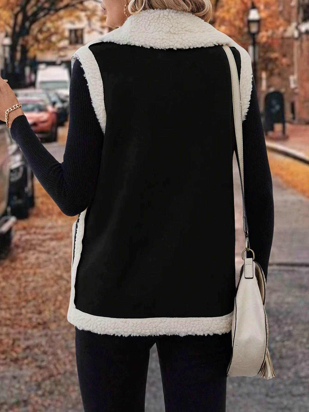 Women's black sleeveless cosy lined lapel gilet in autumn and winter