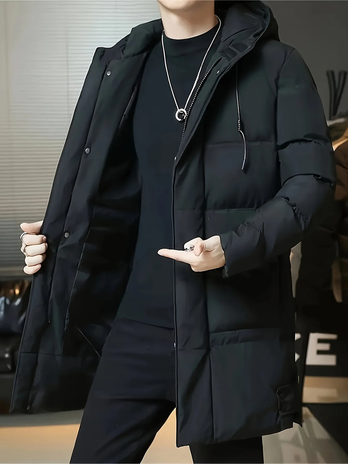 Men's black hooded longline winter coat for cold autumn and winter days