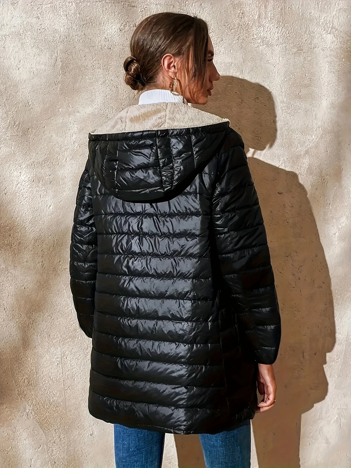 Women's black cosy-lined longline coat for autumn and winter wear