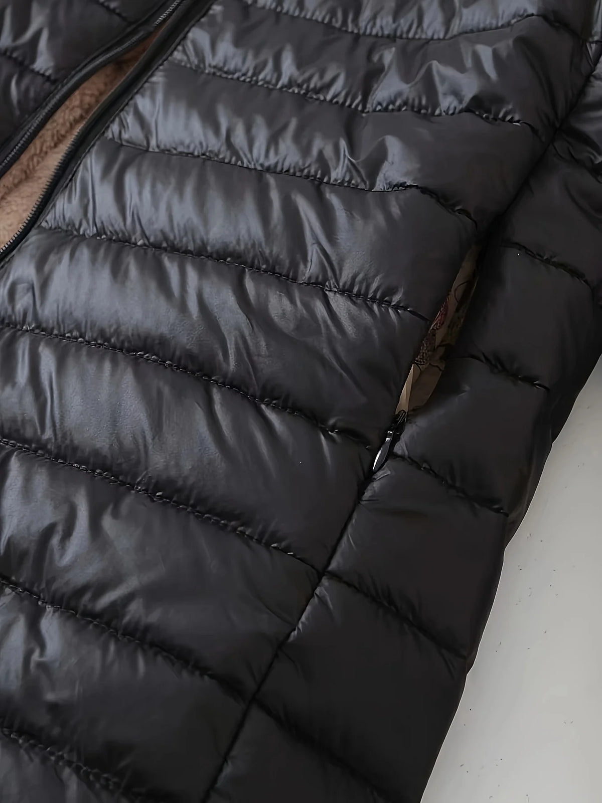 Women's black cosy-lined longline coat for autumn and winter wear