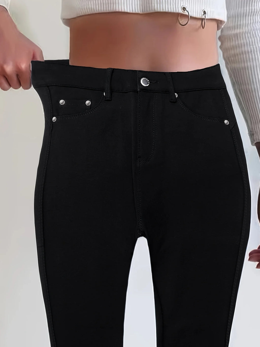 Women's black high-rise skinny jeans for cold autumn and winter days