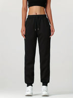 Women's black cosy cuffed joggers for the autumn and winter season