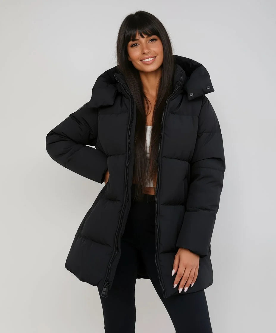 Women's black longline puffer jacket with hood for cold weather wear