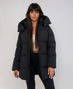 Women's black longline puffer jacket with hood for cold weather wear