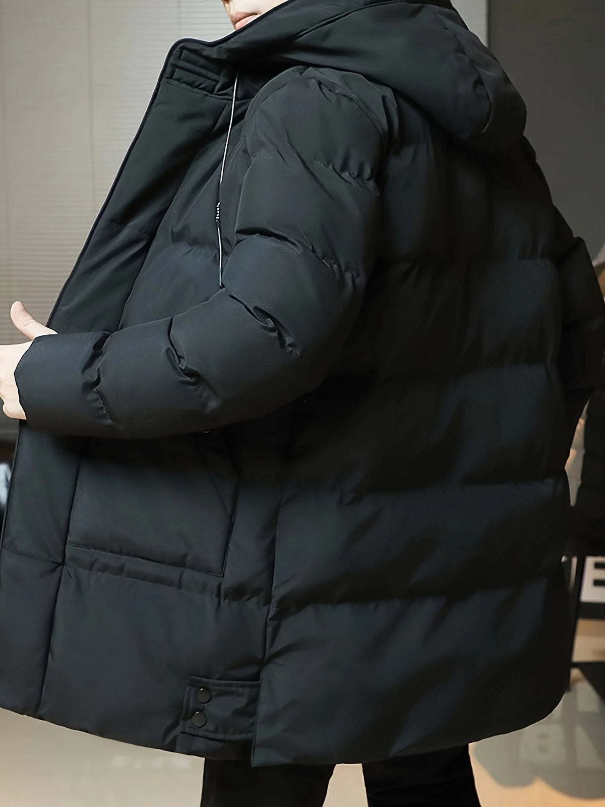 Men's black hooded longline padded coat for autumn and winter layering