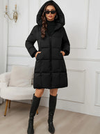 Women's black longline puffer coat with hood for autumn and winter wear