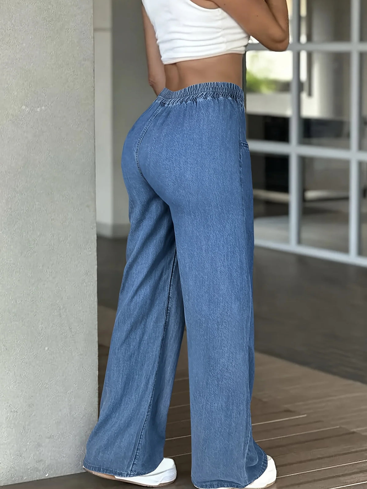 Women's light blue relaxed wide-leg trousers in a soft everyday shade