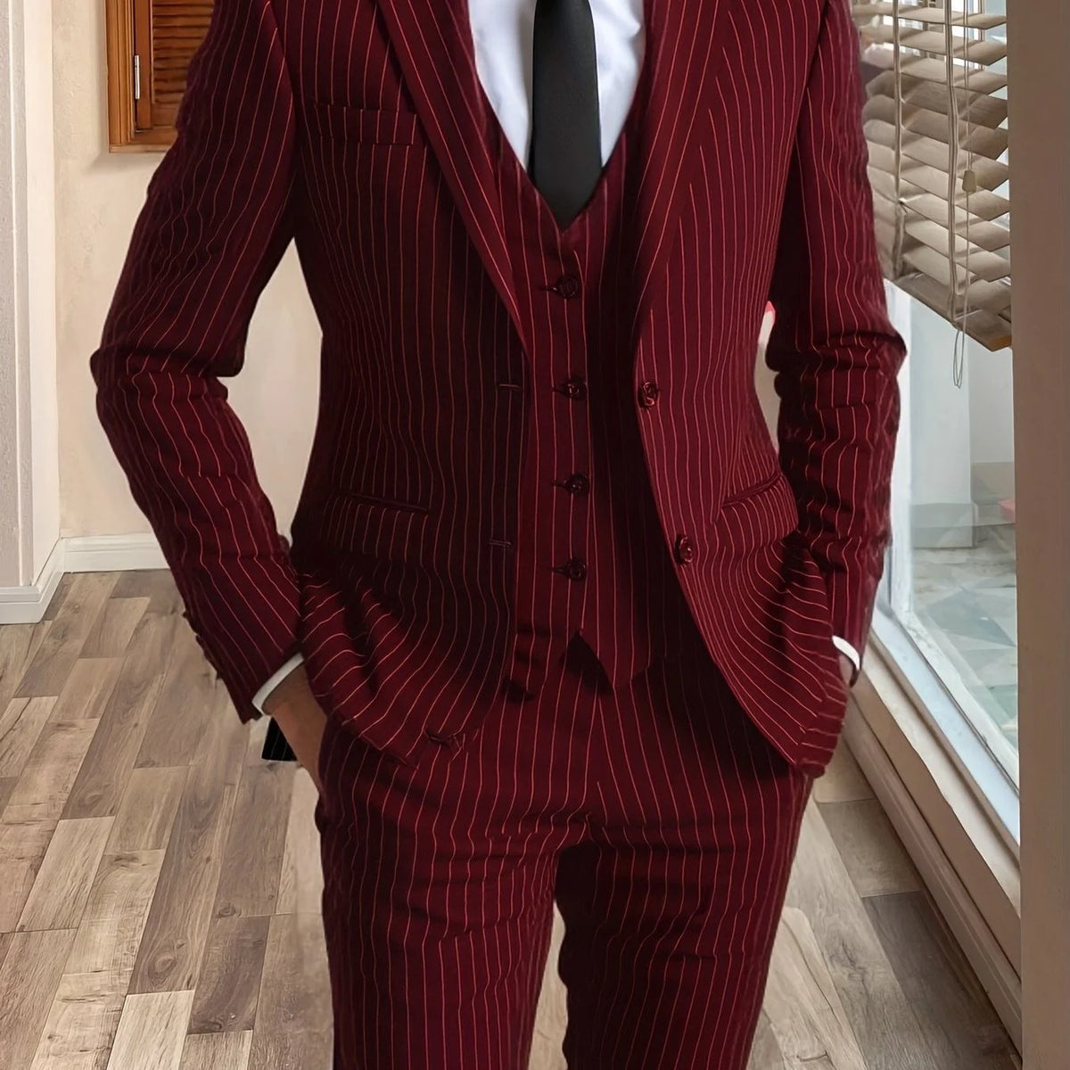 Men's burgundy tailored pinstripe three-piece suit in autumn and winter