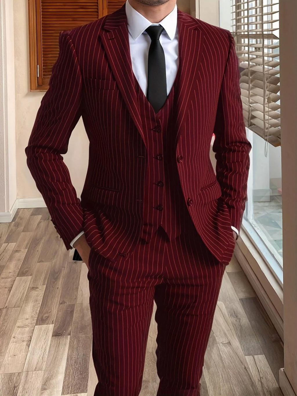 Men's burgundy tailored pinstripe three-piece suit in autumn and winter