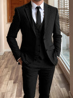 Men's black tailored pinstripe three-piece suit in autumn and winter