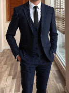 Men's grey tailored pinstripe three-piece suit in autumn and winter
