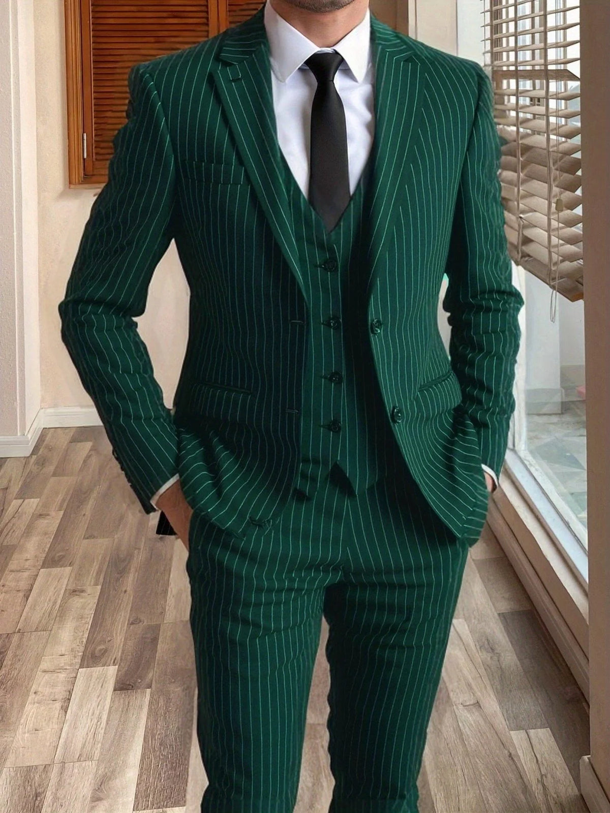 Men's grey tailored pinstripe three-piece suit in autumn and winter
