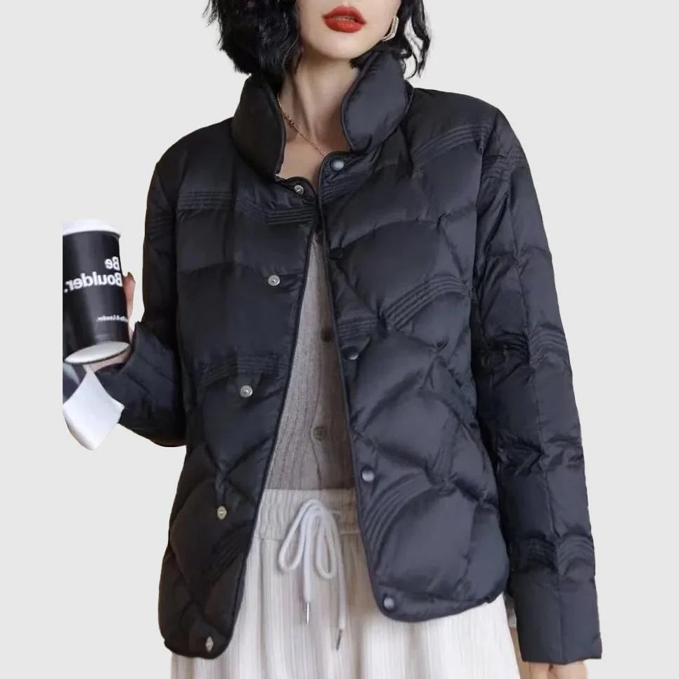 Women's black quilted jacket with stand collar and button front