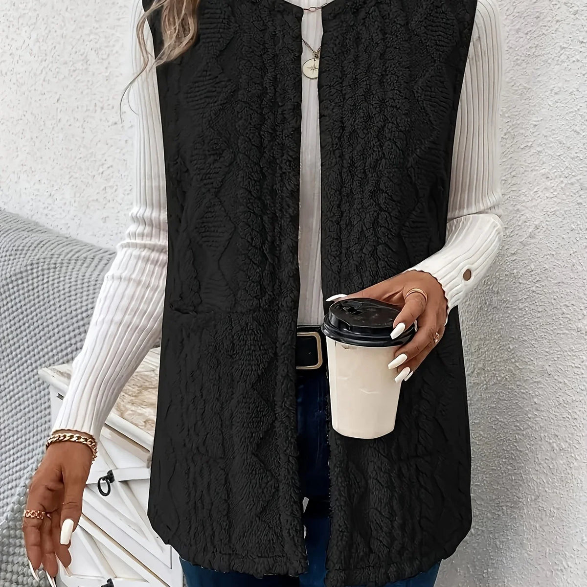 Women's black sleeveless textured gilet for autumn and winter layering