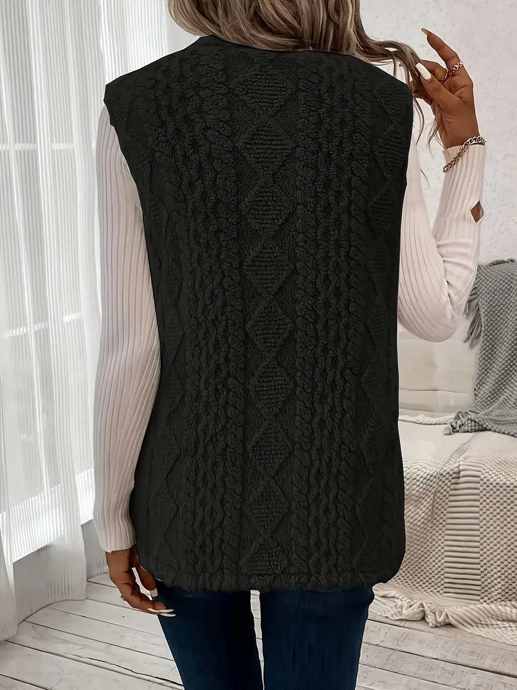 Women's black sleeveless textured gilet for autumn and winter layering