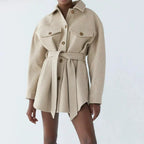 Women's beige belted shacket with chest pockets for colder days