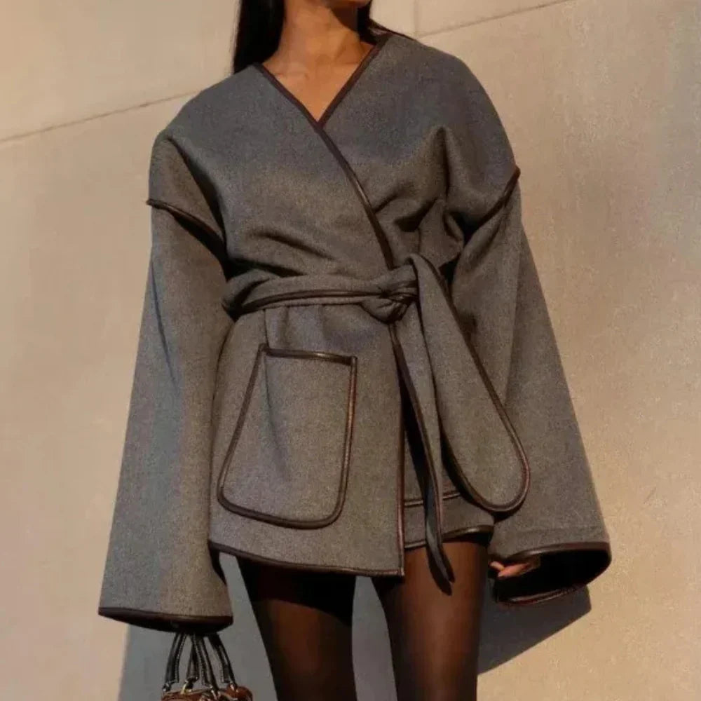 Women's grey belted wrap jacket with wide sleeves for colder days
