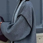 Women's grey belted wrap jacket with wide sleeves for colder days