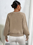 Women's black cropped cable knit jumper with lantern sleeves for winter
