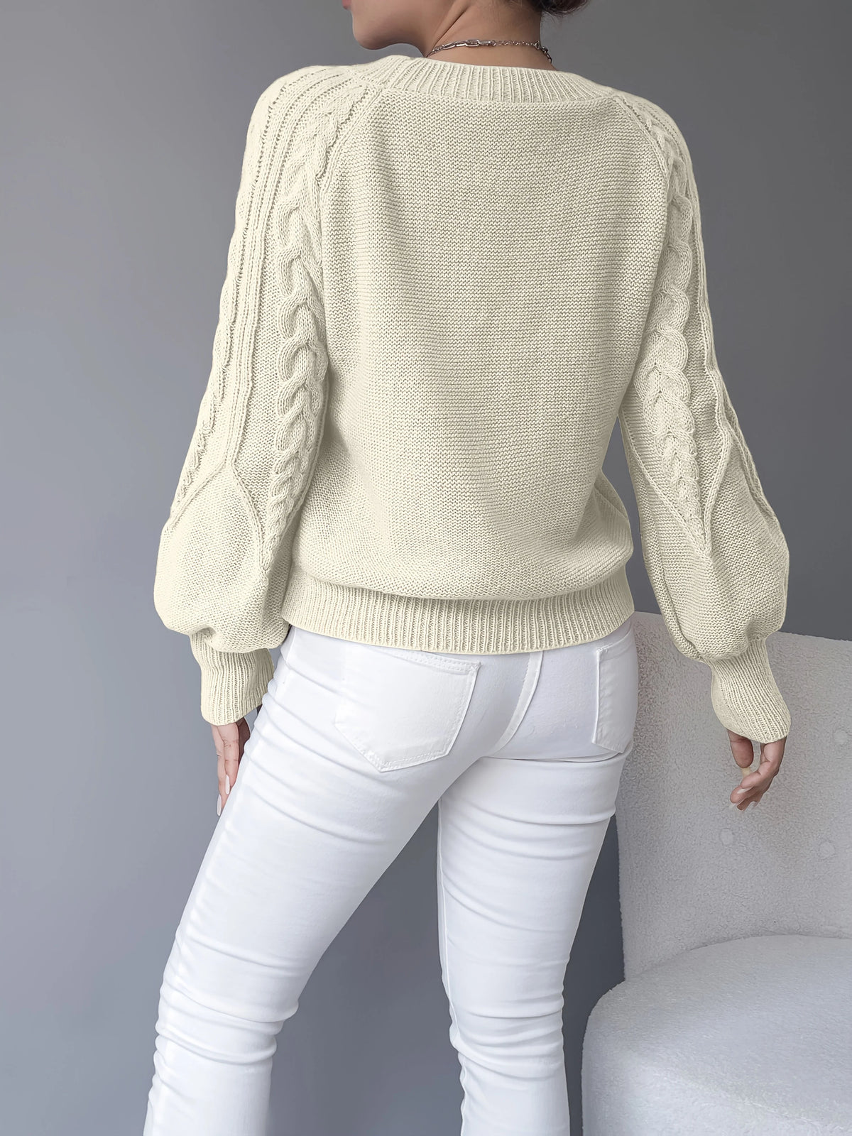 Women's black cropped cable knit jumper with lantern sleeves for winter