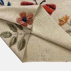 Women's beige embroidered floral knit sweater, fabric detail