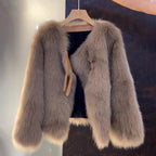 Women's beige faux fur jacket with buckle detail for autumn wear