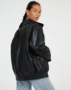 Women's black oversized leather jacket with collar for the season