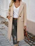 Women's beige oversized trench coat with notched lapel and belt