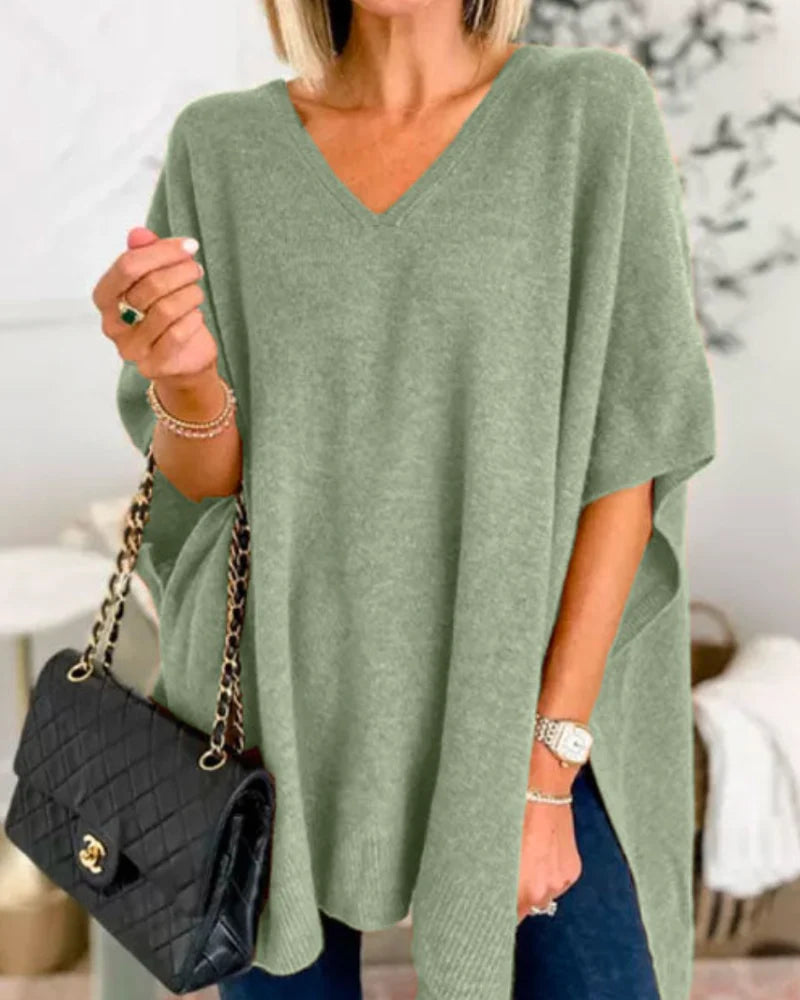 Women's green oversized v-neck poncho jumper for cold weather wear